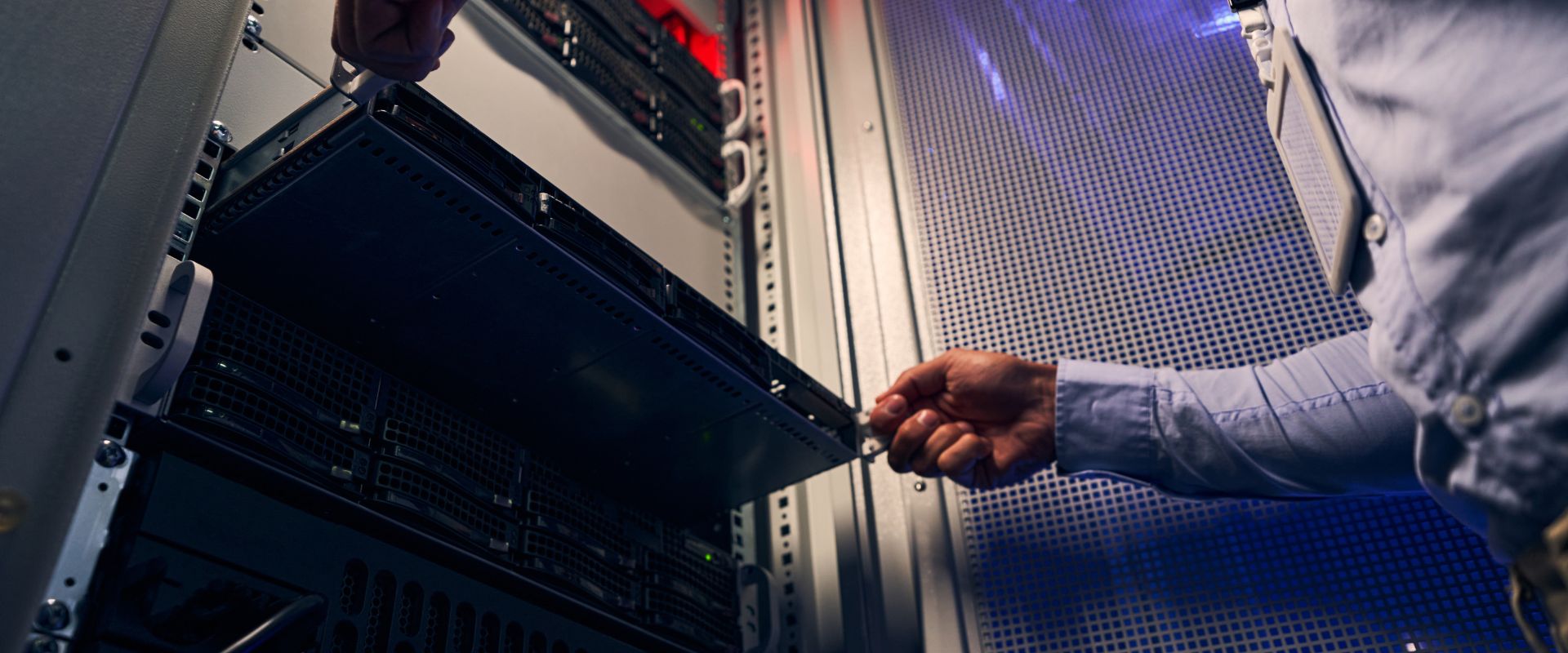 background image of a man werking on server installation